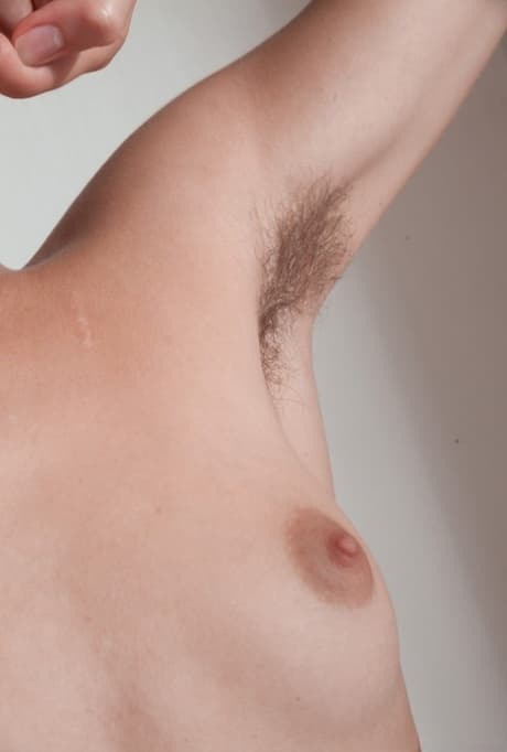 Thin amateur Alecia Fox tugs on hairy pussy lips after displaying hairy pits