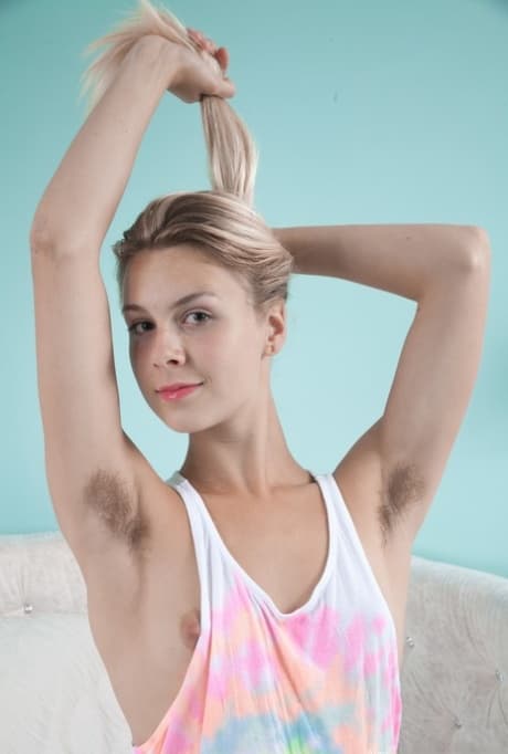 Amateur model Alecia Fox proudly shows off her hairy pits and pussy on her bed