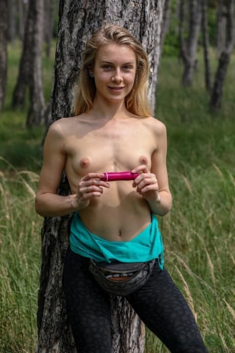 Skinny blonde Alecia Fox dildoing her horny pussy while fully naked outdoors